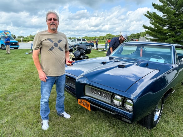HR Manager Mark Mastin stands next to his GTO, winner of the People’s Choice award.
