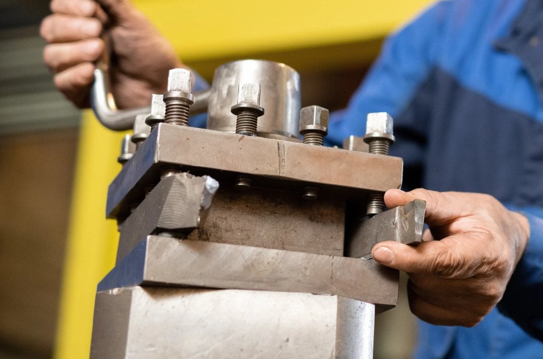 Man repairing a broken component in Texas